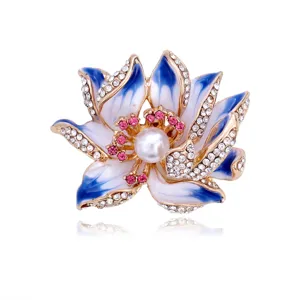 Lotus flower enamel brooch close-up featuring sparkling rhinestones and a central pearl accent.