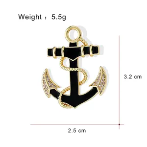 Detailed close-up of a stylish gold-plated black enamel anchor brooch with sparkly rhinestone accents.