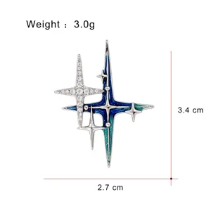 Exquisite multi-pointed star brooch with blue enamel and sparkling cubic zirconia crystals.