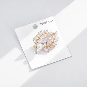 Exquisite wheat leaf brooch with shiny zirconia and pearl, elegant suit accessory.