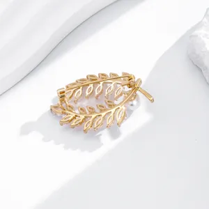 Exquisite gold-plated leaf brooch detailed with sparkling cubic zirconia and pearl accent.
