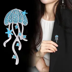 Stunning rhinestone jellyfish brooch detail shot, blue crystal sea star pin for women.