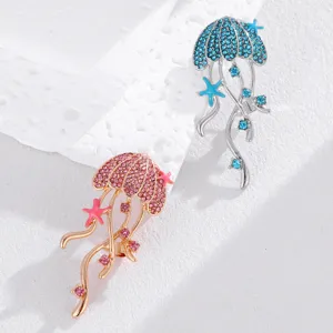Exquisite jellyfish brooch featuring sparkling rhinestones and cute starfish, elegant accessory.