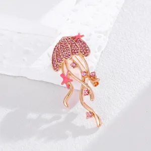 Exquisite pink rhinestone jellyfish brooch, elegant starfish design accessory for women's wear.