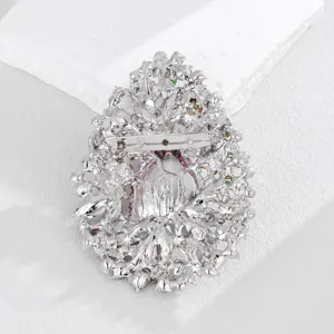 Detailed view of the crystal brooch back, showing secure pin clasp and intricate filigree craftsmanship.