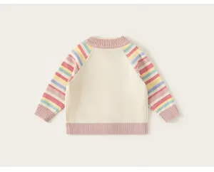 Details of kids knit sweater with colorful striped sleeves and pink ribbed cuffs trim.