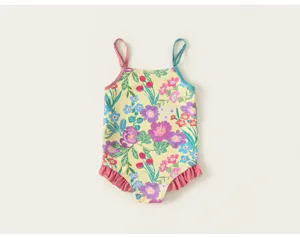 Girls floral one-piece swimsuit with colorful botanical patterns, thin straps and sweet ruffles.