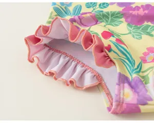 Girls floral print one-piece swimsuit detail showing cute pink ruffles summer beachwear