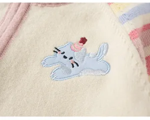 Close-up of kids cute embroidered cat knitted cardigan sweater with colorful striped sleeve detail.