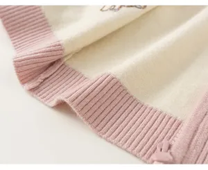 Children knit cardigan detail shot, beige and pink striped sweater coat for baby girls kids.