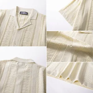 Close-up details of cream knit polo shirt showing wheat-ear jacquard texture and buttons