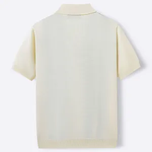 Detailed back view of a premium cream short-sleeved knit polo shirt for men featuring a ribbed hem