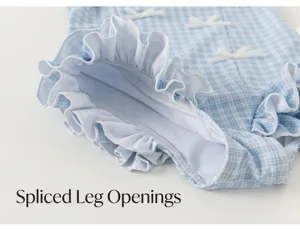 Girls blue plaid swimsuit leg detail with cute ruffles and small white bow decorations.