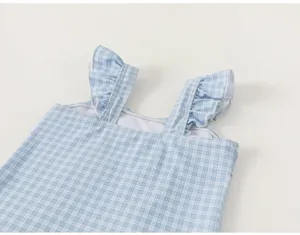 Girls cute blue white plaid one piece swimsuit detail, ruffled strap swimwear close-up