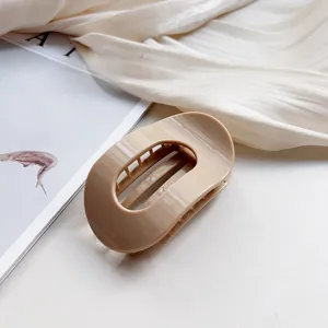 Beige oval hair claw clip minimalist silicone shark clip for women daily elegant hair styling detail