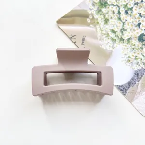 Matte rectangular hair claw clip close-up, premium 6.5cm aesthetic design for women daily styling.