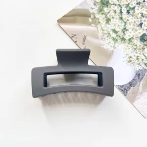 Matte grey square hair claw clip detail, minimalist hair accessory for daily styling.