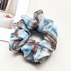 Blue and brown plaid chiffon hair scrunchie with rhinestones, detail view of cute hair accessory.