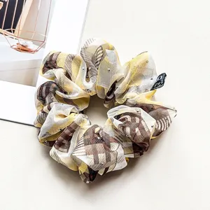 Chiffon rhinestone hair scrunchie for women, elegant yellow plaid hair tie accessory.