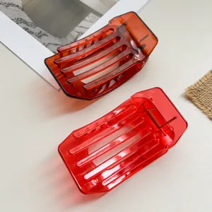 Detailed view of large flat hair claw clips, translucent hollow design for daily hair.
