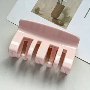Minimalist pink hair claw clip for women, elegant daily styling hair accessories.