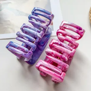 Marble pattern claw clip detail, dual-color large hair clamp with hollow comb teeth design.