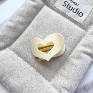Matte hollow heart hair claw clip, small cute aesthetic hair accessory for women daily styling.