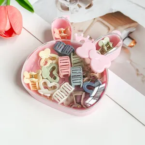 Joli ensemble de mini pinces à cheveux dans une boîte lapin rose, idéal pour coiffure quotidienne.