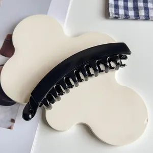Black banana hair clip, minimalist vertical hair claw for stylish ponytails and everyday use.