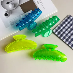 Molla per capelli trasparente e colorata in gelatina, design minimal per acconciature.