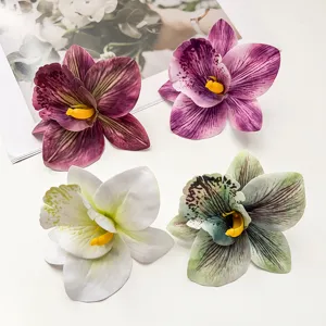 Detailansicht künstlicher Orchideen-Haarspangen im Boho-Stil mit vier verschiedenen Farben.