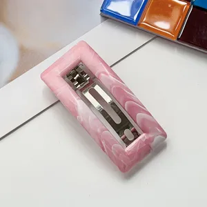 Detailed view of the pink marble spring hair clip, versatile chic hair barrette for daily styling.