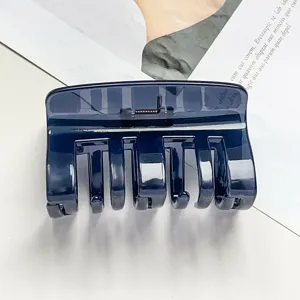 Dark blue hair claw clip detail, minimalist resin shark clip for daily elegant updo.