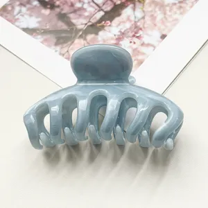 Molla per capelli marmo blu donna, accessorio elegante in resina per styling quotidiano.