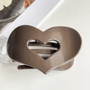 Brown heart-shaped hair claw clip, large size design for elegant daily hair styling and updo.