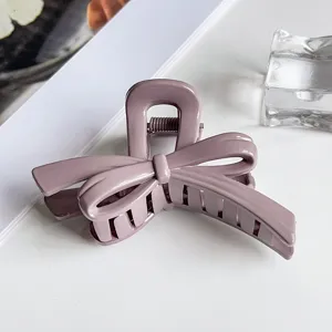Elegant purple bow hair claw clip for women, large stylish shark clip for daily hair styling.