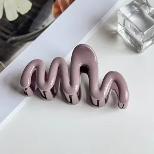 Elegant purple wavy hair claw clip for women, stylish hair accessory for daily styling and elegant updos.