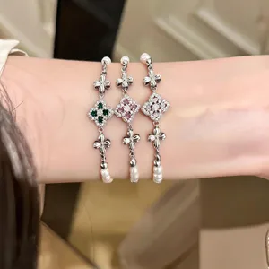 Chic French retro floral pearl bracelet featuring sparkling multi-color cubic zirconia stones.