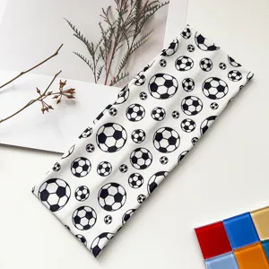 Detailed view of the elastic sports headband featuring a trendy black and white soccer ball print.