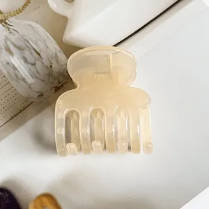 Jelly resin hair claw clip, minimalist translucent cream design for daily elegant ponytails.