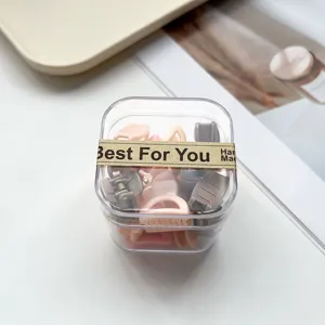 Joli ensemble de pinces à cheveux dans une boîte transparente, idéal pour le coiffage quotidien.