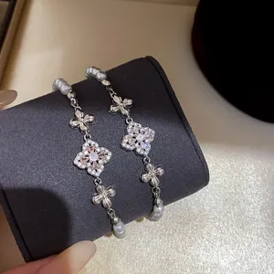 Elegant clover cz pearl bracelet, vintage french style jewelry, sparkling floral design.