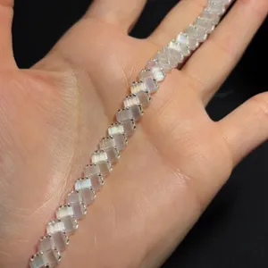 Close-up detail view of translucent cubic beaded bracelet with fine metallic links.