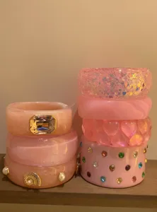 Pink chunky resin bangle set featuring glitter, rhinestones, and sweet hearts style.