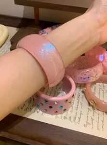 Pink glitter wide resin bangle detail, trendy fashion casual bracelet for women daily wear.