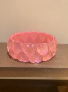 Pink heart resin bangle detail shot, showing the cute layered design and glossy surface finish.