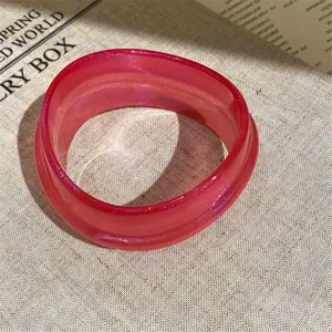 Minimalist pink acrylic resin bangle bracelet, stylish geometric stacked wrist jewelry for women.