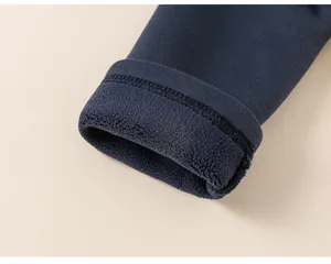 Dark blue children's garment thermal fleece lined sleeve cuff detail close-up view