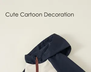 Close-up detail of children's color-block hooded jacket, featuring raglan sleeves and zipper.