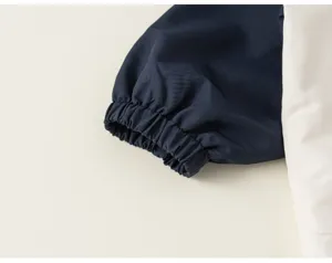 Kids jacket sleeve detail, elastic cuff design, contrast color stitching, comfortable wear.